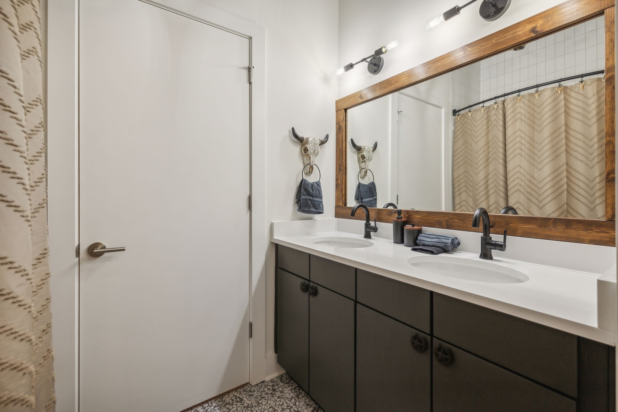 1310 Lischey Avenue, Unit 306 Nashville, TN 37207 - Photo 39 of 58 a bathroom with a double vanity sink and a mirror