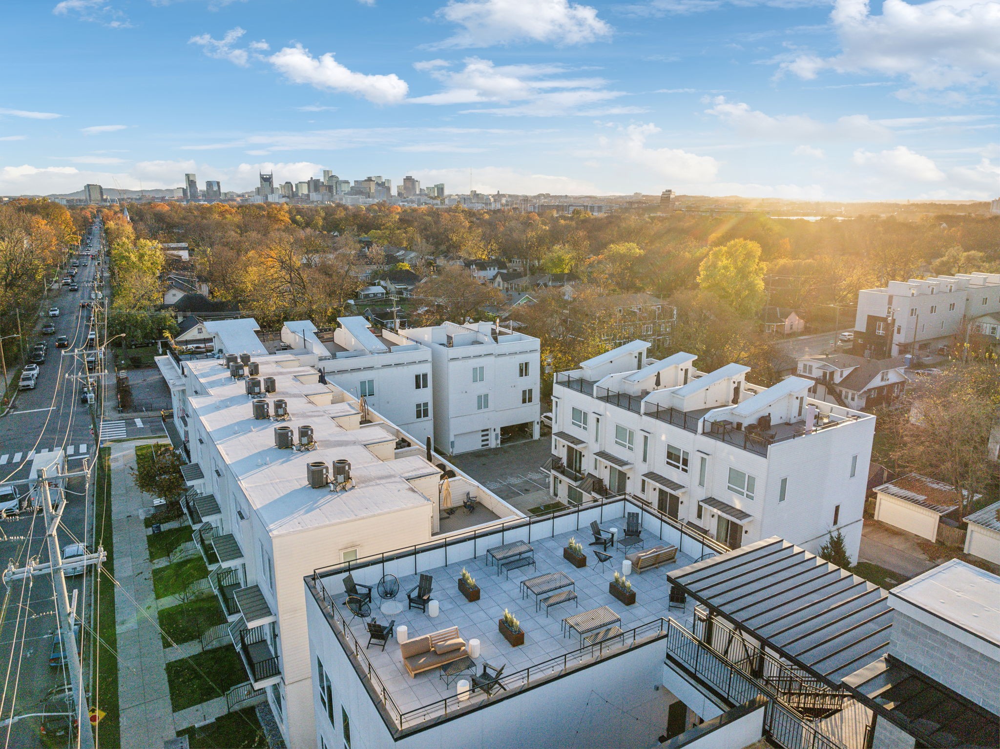 1310 Lischey Avenue, Unit 306 Nashville, TN 37207 - Photo 55 of 58 an aerial view of a house with roof deck outdoor seating and city view