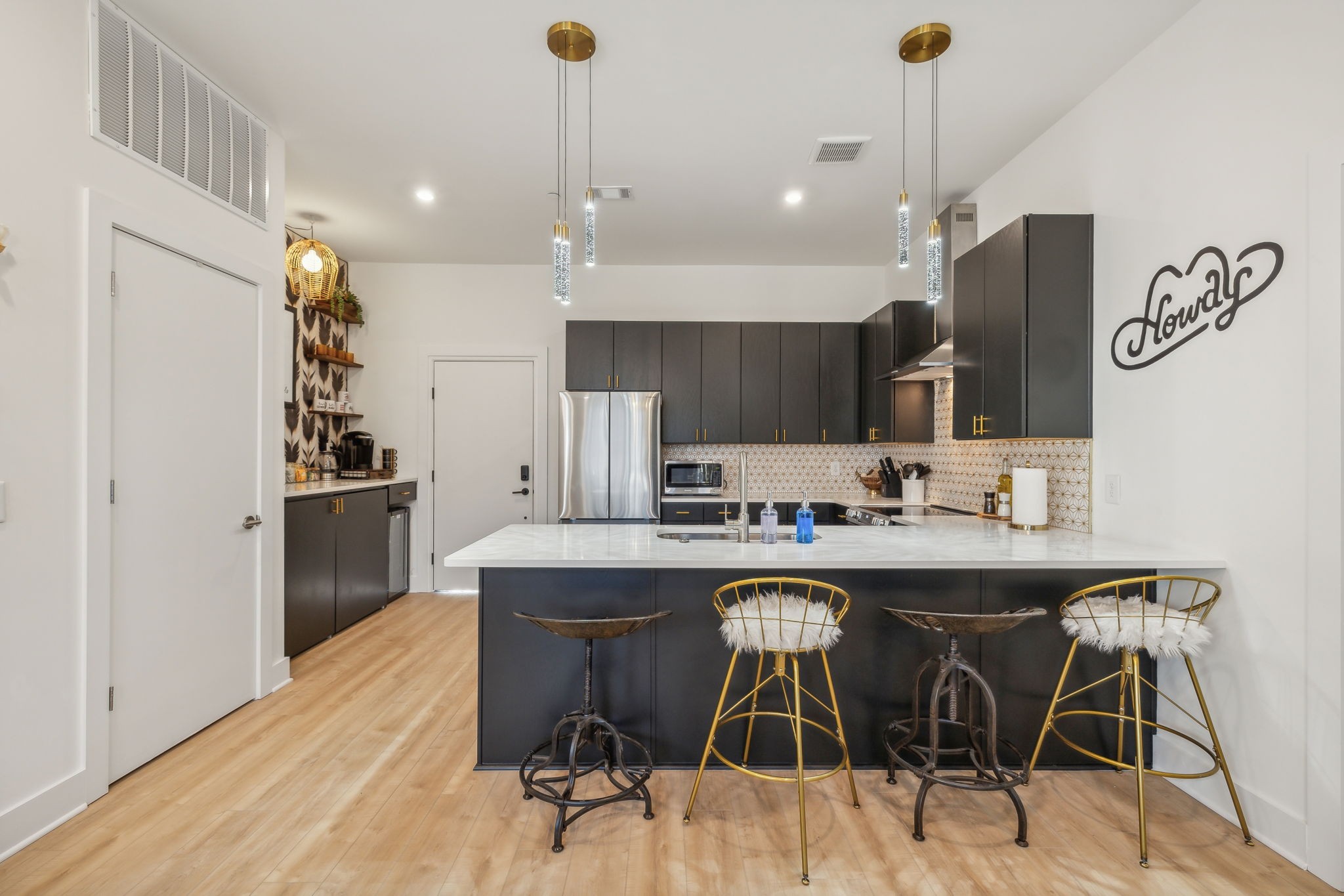1310 Lischey Avenue, Unit 306 Nashville, TN 37207 - Photo 9 of 58 a kitchen with kitchen island stainless steel appliances a sink and cabinets