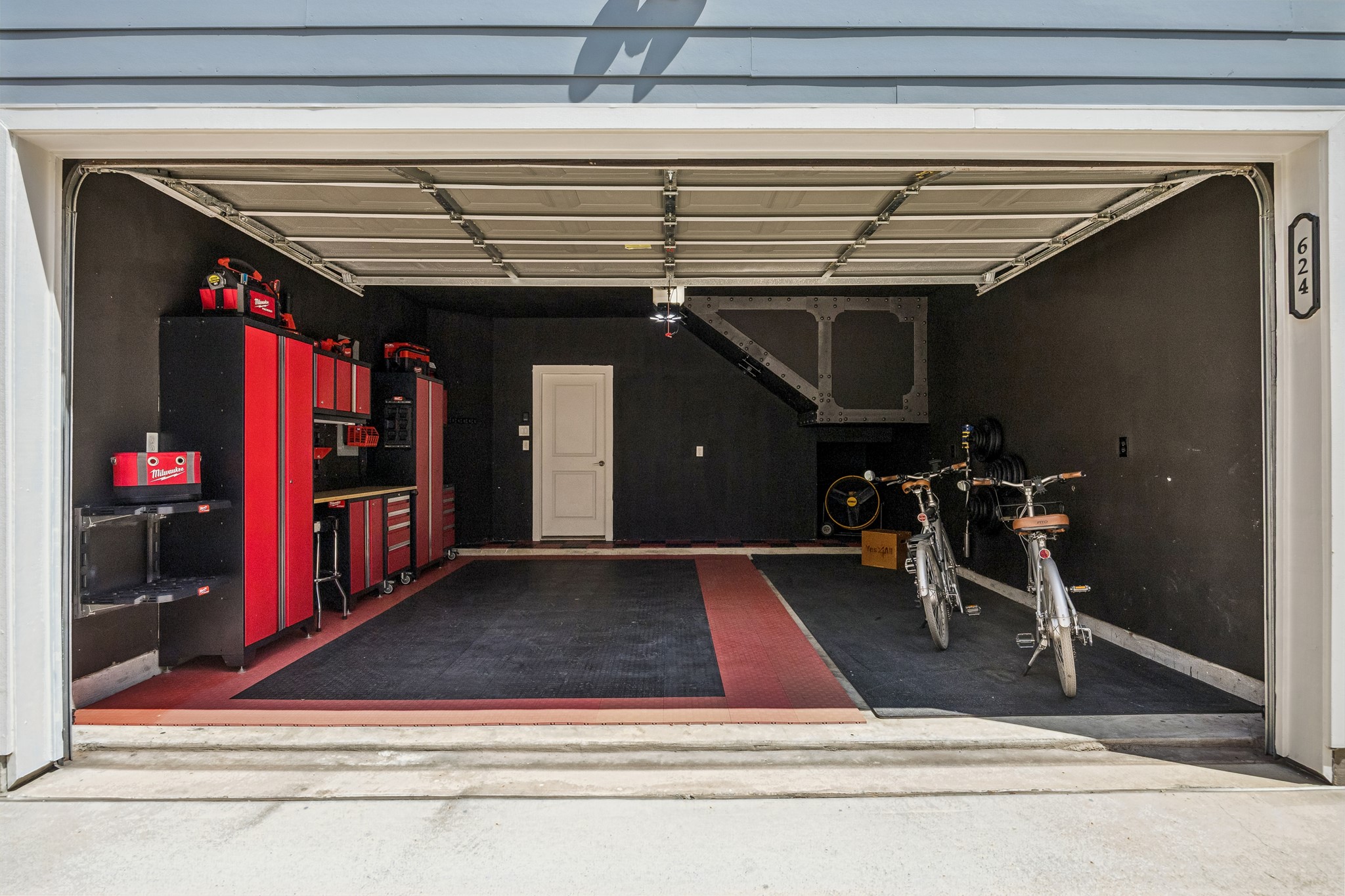 624 East 28th Street Houston, TX 77008 - Photo 32 of 34 Another view of the garage showcasing the industrial-grade cabinetry system and organized workspace.