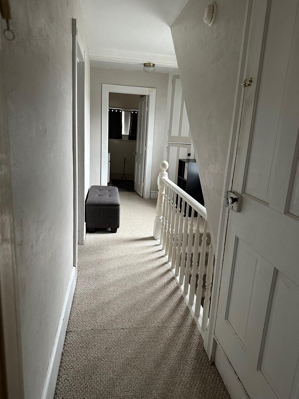 321 West Main Street Millville, NJ 08332 - Photo 12 of 23 a bedroom with wooden floor and stairs
