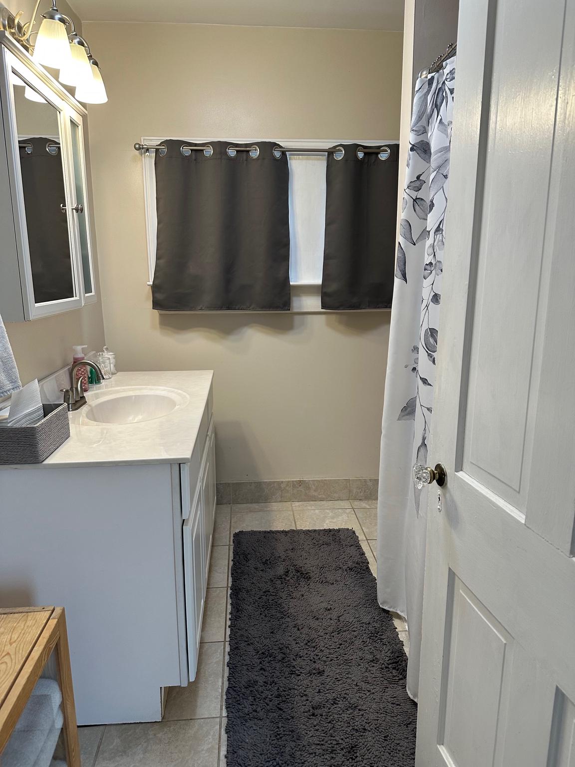 321 West Main Street Millville, NJ 08332 - Photo 15 of 23 a bathroom with a sink and a mirror
