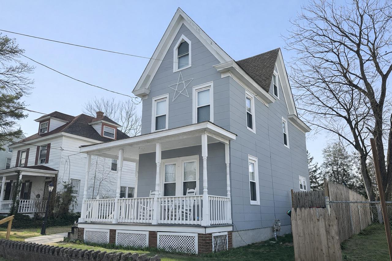 321 West Main Street Millville, NJ 08332 - Photo 2 of 23 a front view of a house with a yard