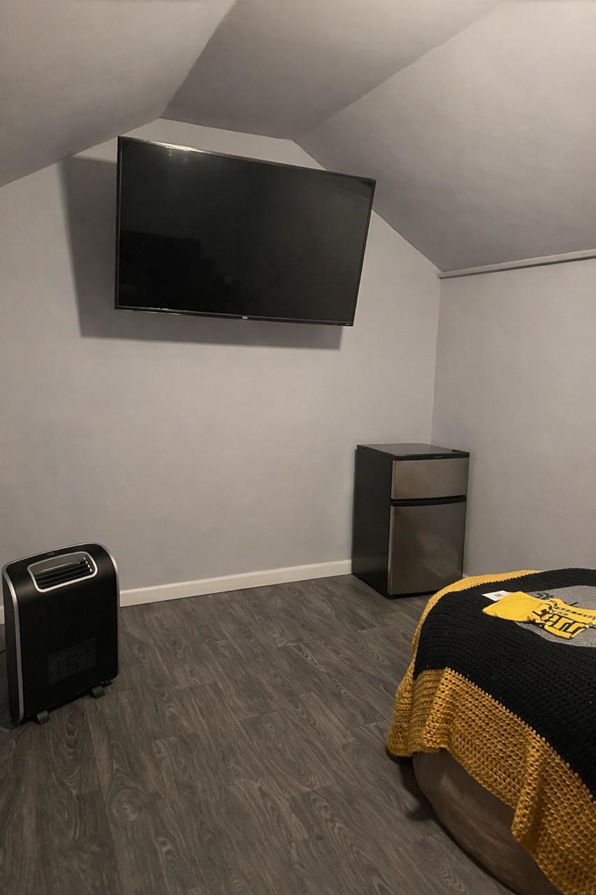 321 West Main Street Millville, NJ 08332 - Photo 22 of 23 a bedroom with a bed and a television