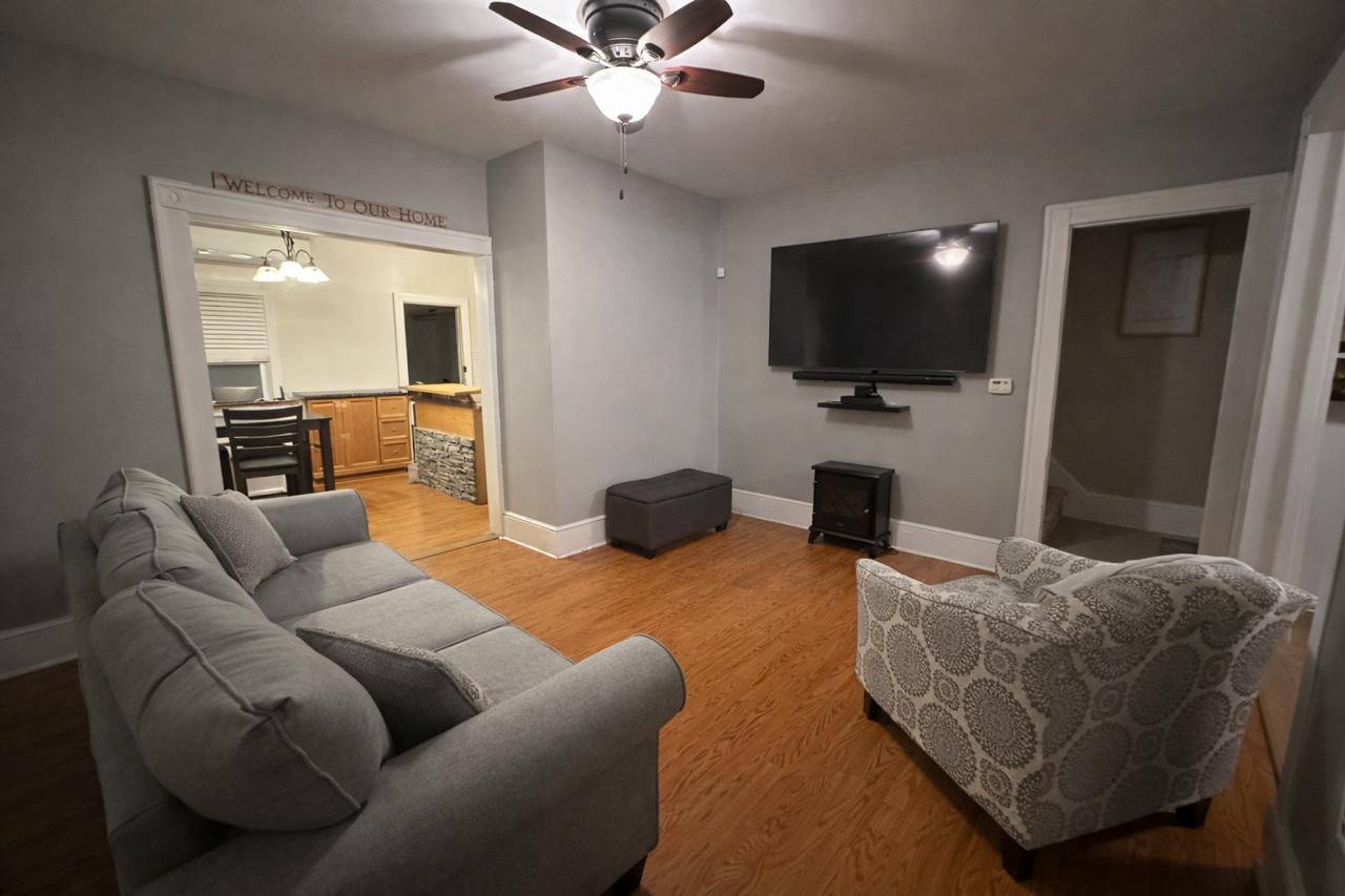 321 West Main Street Millville, NJ 08332 - Photo 4 of 23 a living room with furniture and a flat screen tv