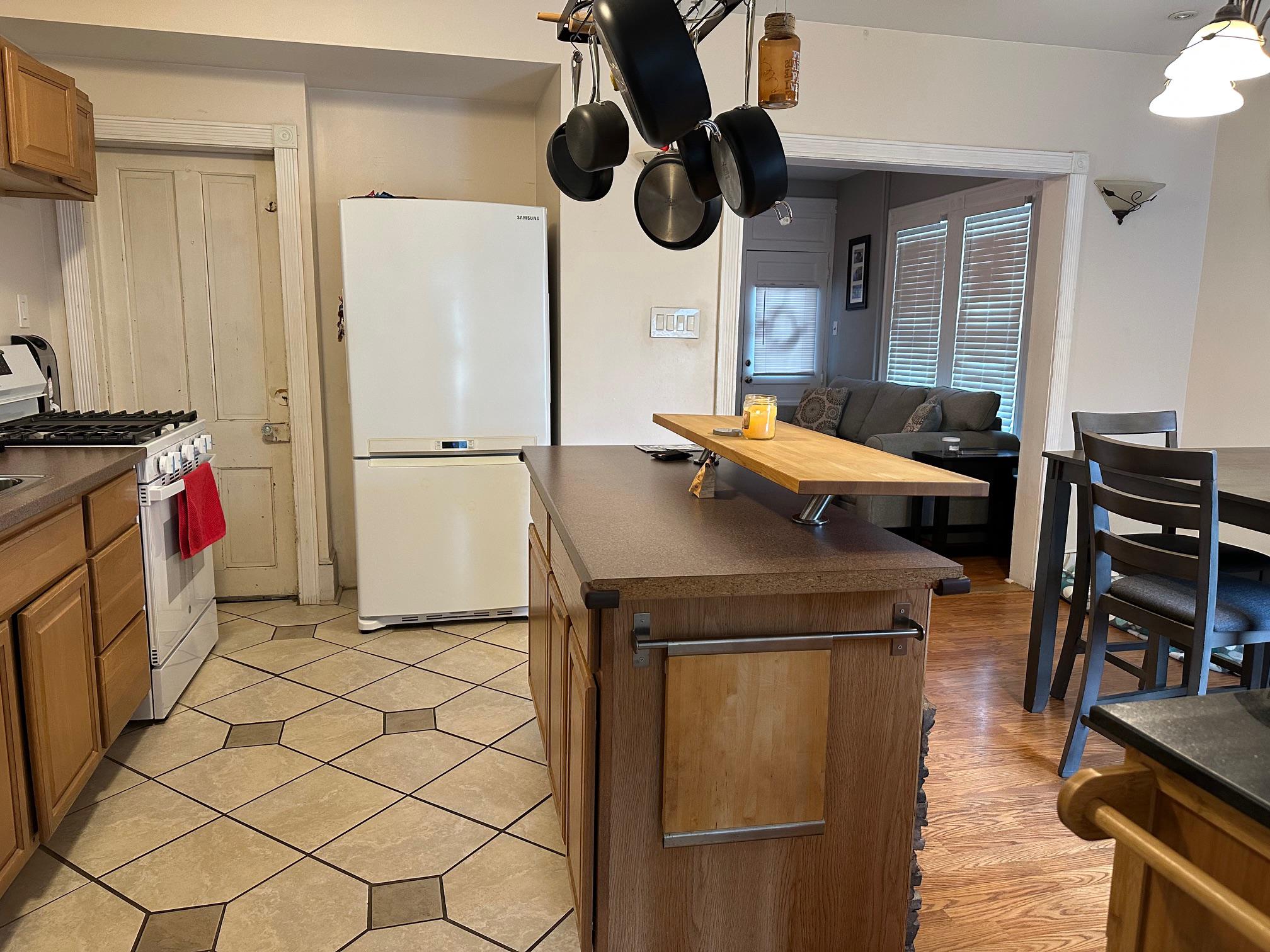 321 West Main Street Millville, NJ 08332 - Photo 8 of 23 a kitchen with stainless steel appliances granite countertop a refrigerator and a stove top oven