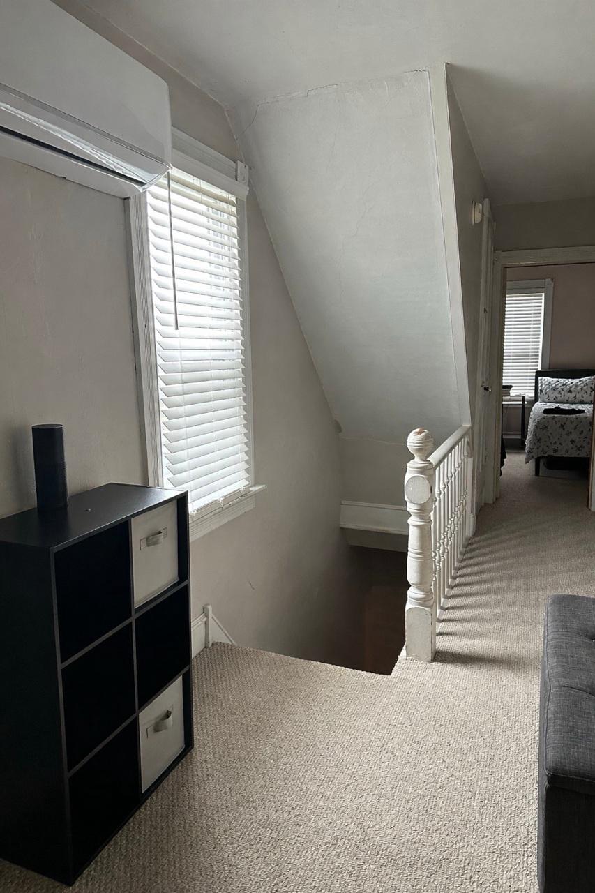 321 West Main Street Millville, NJ 08332 - Photo 10 of 23 a room with a bed and a window