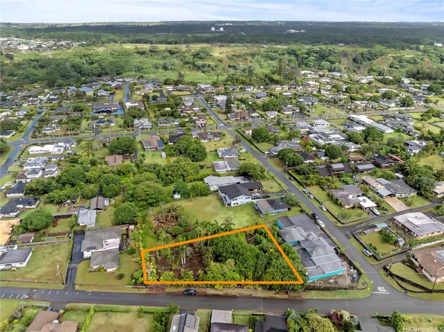 an aerial view of residential building with outdoor space and trees