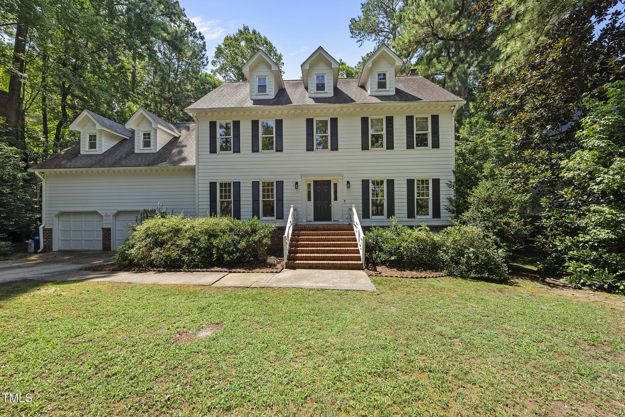 8716 Mourning Dove Road Raleigh, NC 27615 - Photo 1 of 44 a front view of a house with yard and green space
