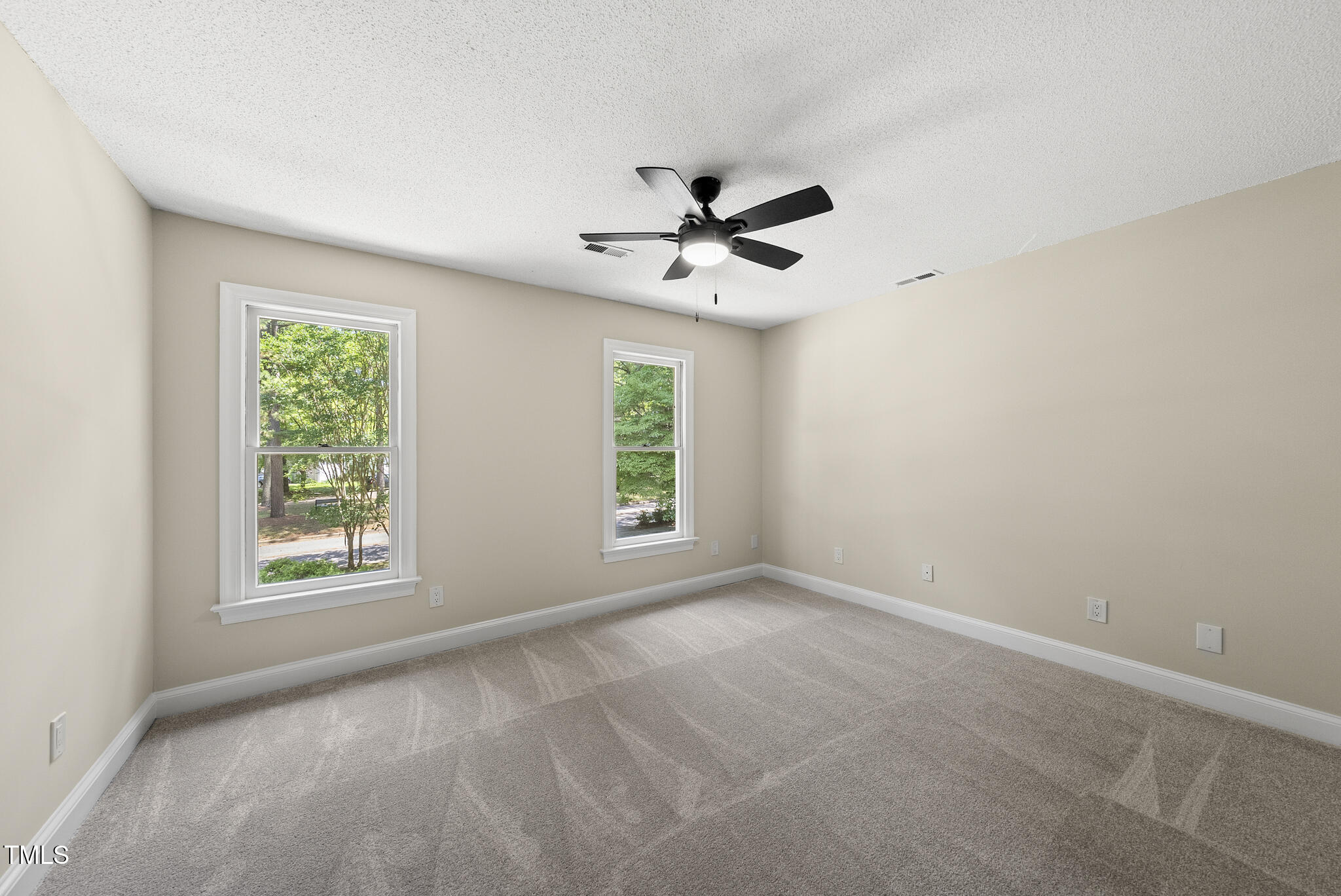 8716 Mourning Dove Road Raleigh, NC 27615 - Photo 16 of 44 a view of an empty room with a window