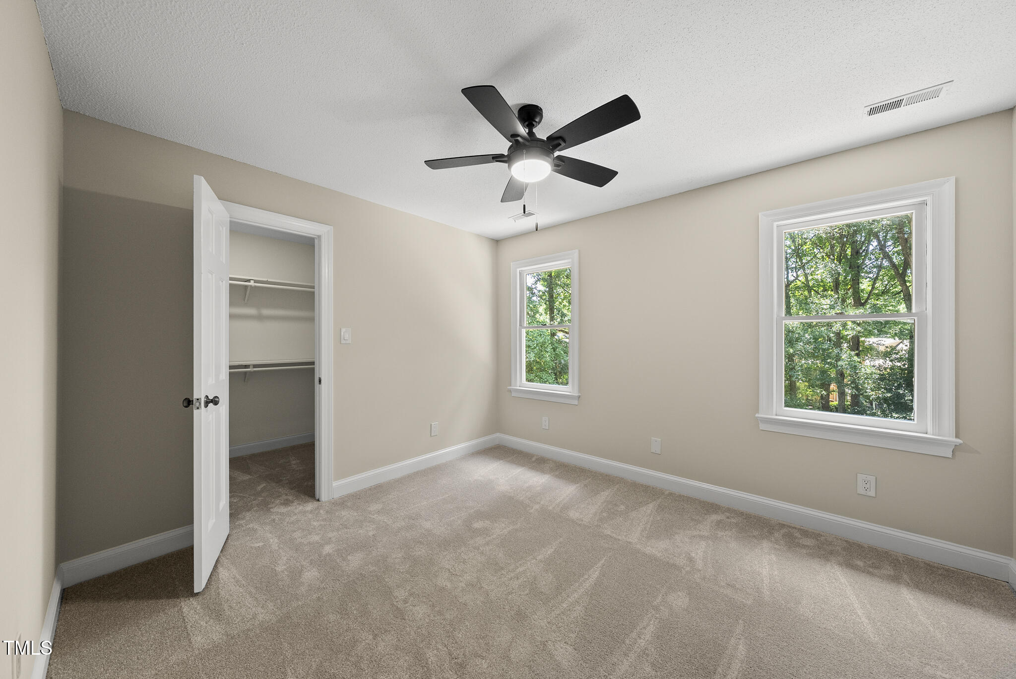 8716 Mourning Dove Road Raleigh, NC 27615 - Photo 18 of 44 a view of an empty room with a window