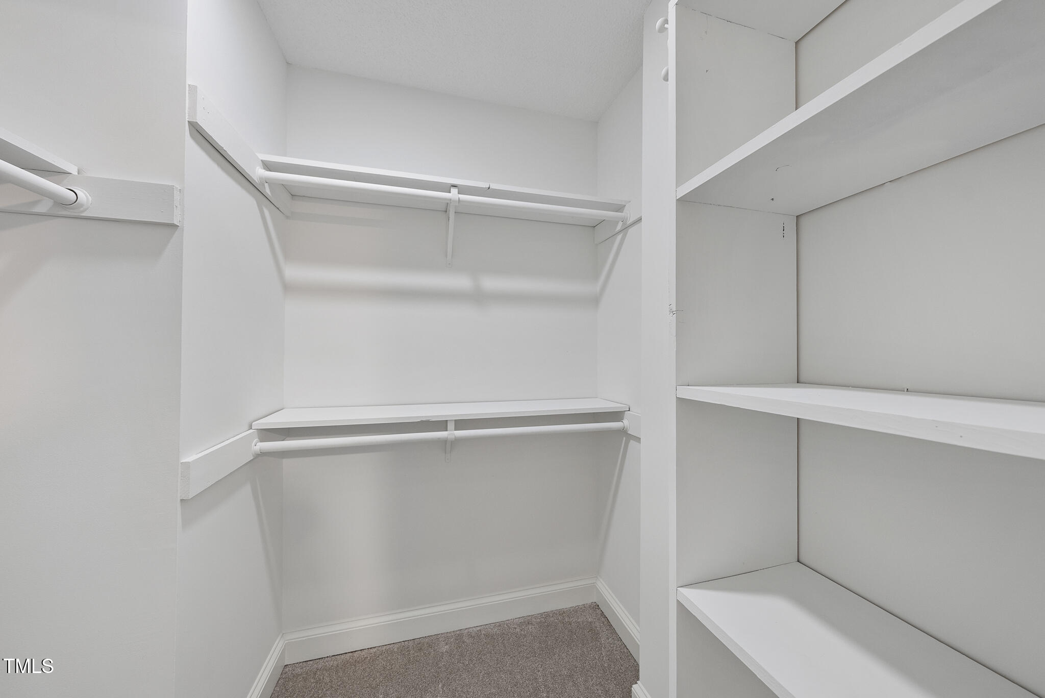 8716 Mourning Dove Road Raleigh, NC 27615 - Photo 19 of 44 a view of an empty walk in closet