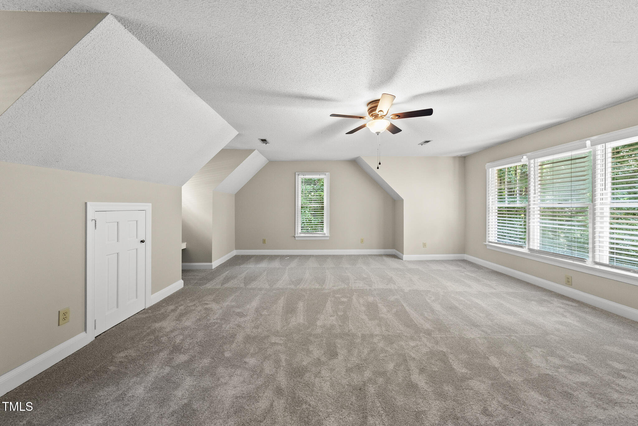 8716 Mourning Dove Road Raleigh, NC 27615 - Photo 20 of 44 a view of an empty room with a window