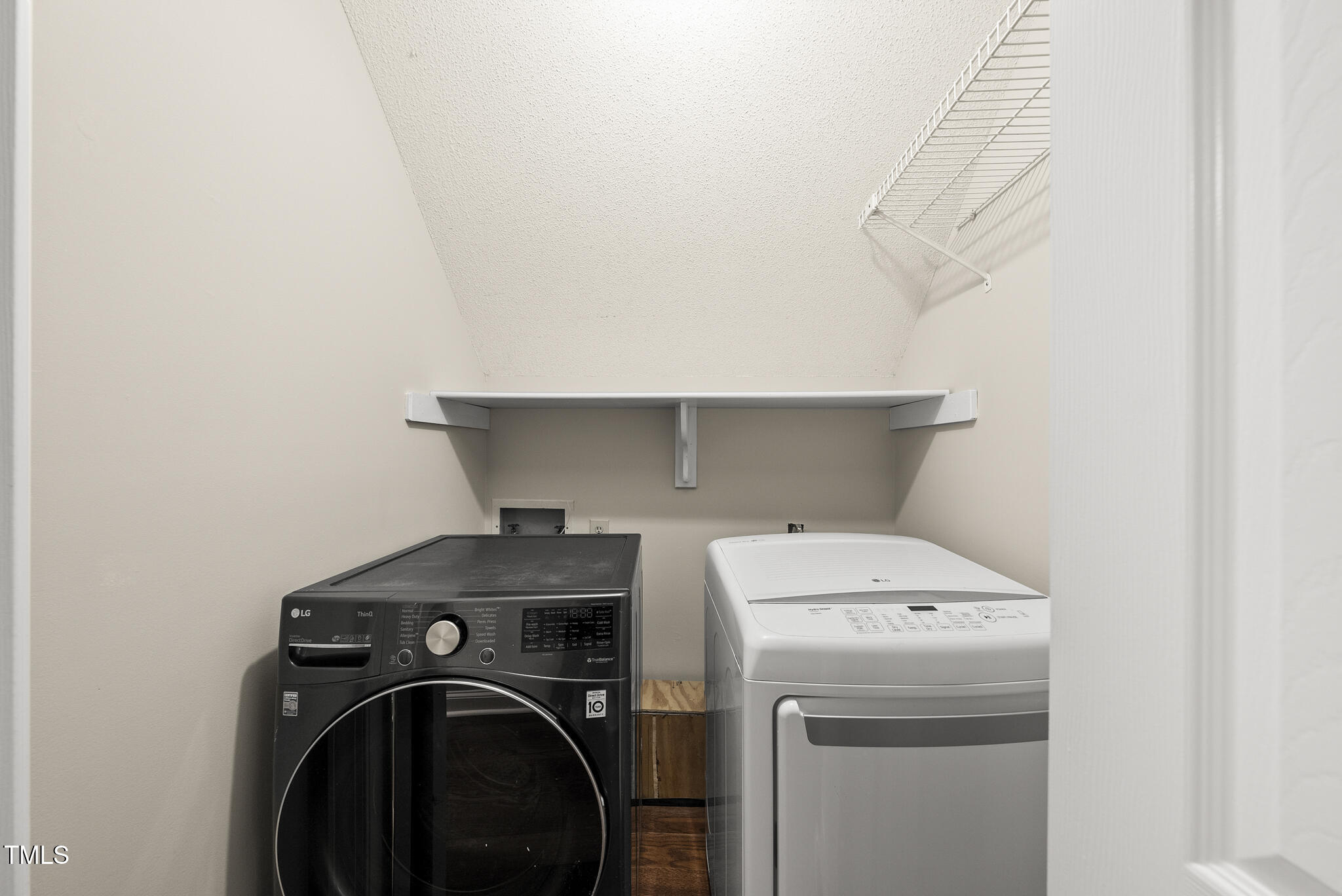 8716 Mourning Dove Road Raleigh, NC 27615 - Photo 23 of 44 a utility room with dryer and washer