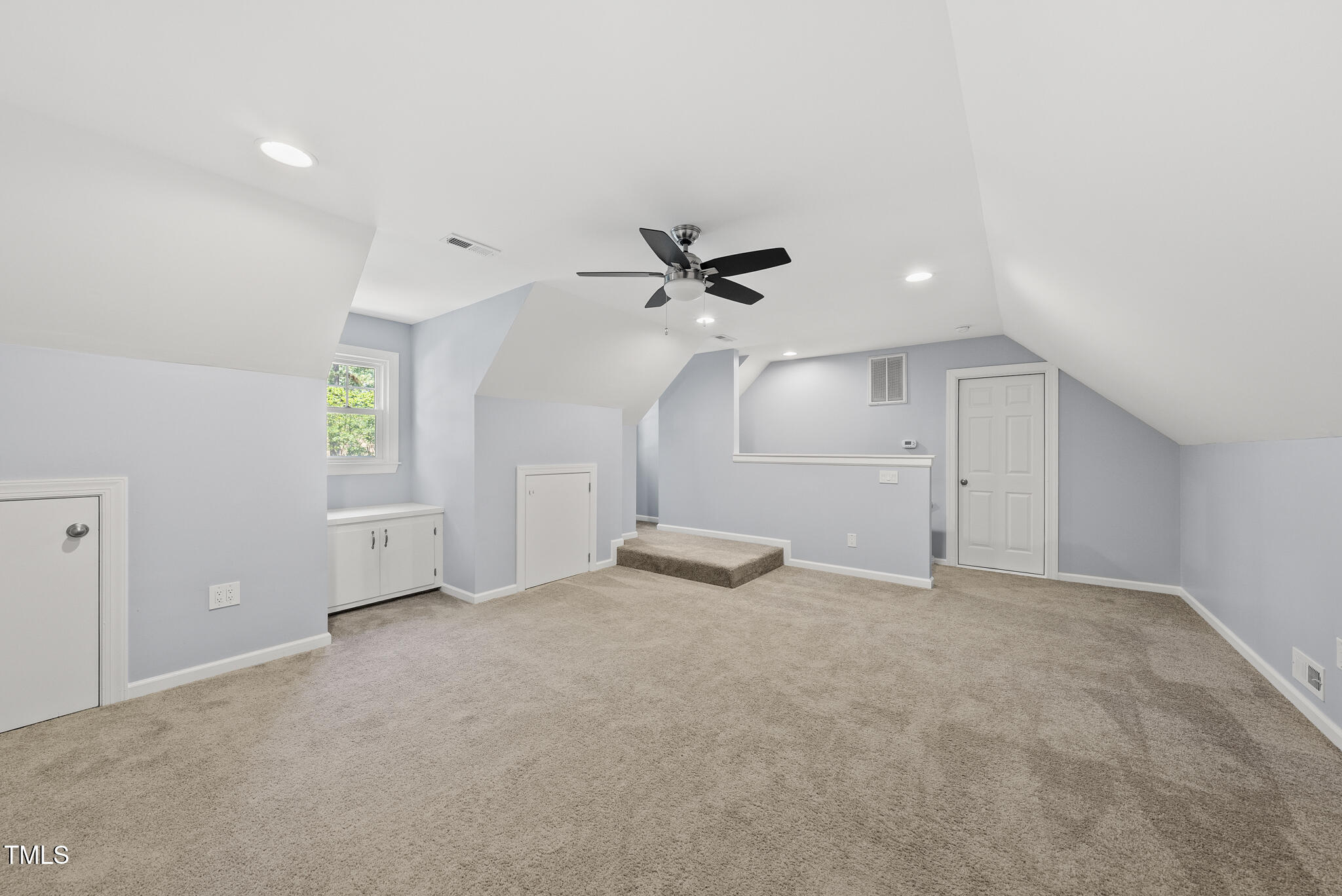 8716 Mourning Dove Road Raleigh, NC 27615 - Photo 25 of 44 an empty room with closet and windows