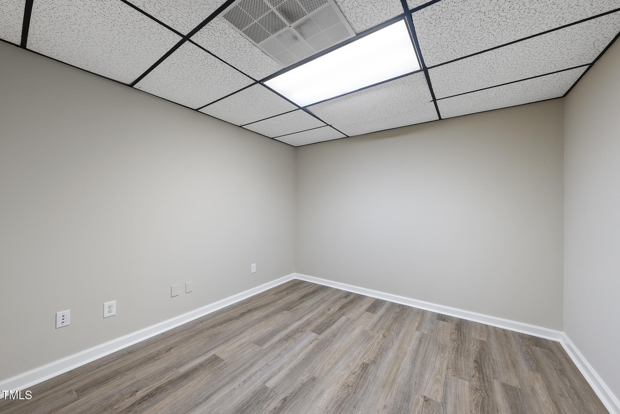 8716 Mourning Dove Road Raleigh, NC 27615 - Photo 26 of 44 a view of a room with wooden floor