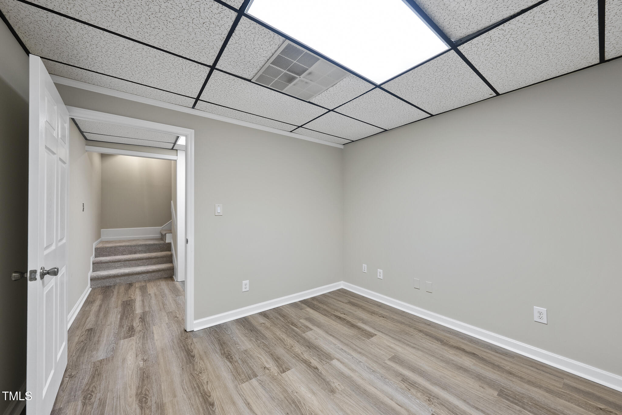 8716 Mourning Dove Road Raleigh, NC 27615 - Photo 27 of 44 a view of a room with wooden floor