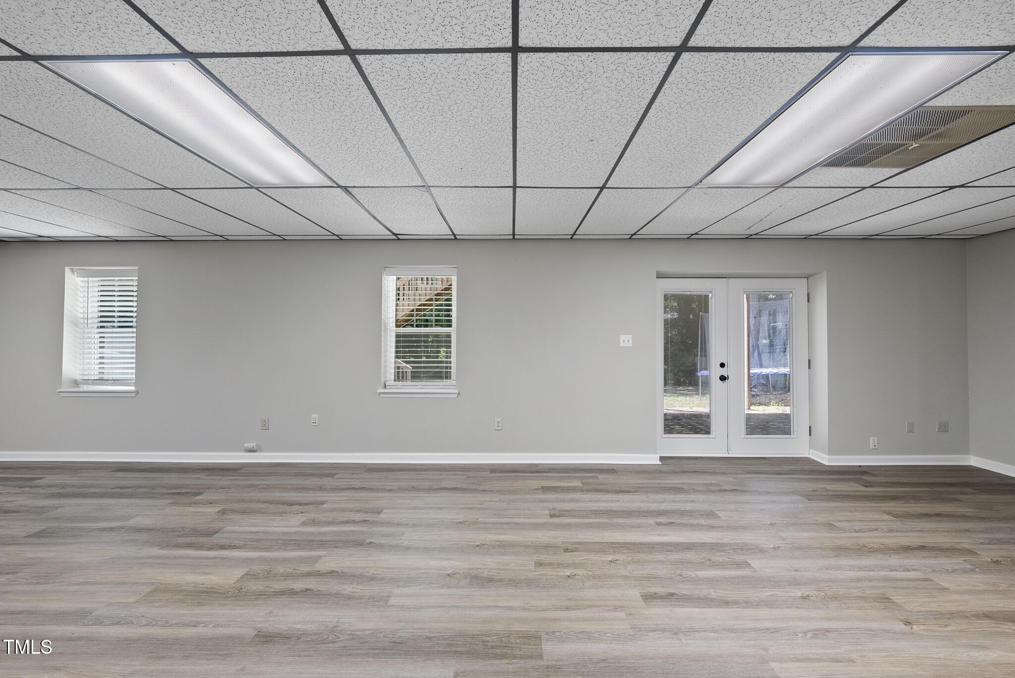 8716 Mourning Dove Road Raleigh, NC 27615 - Photo 28 of 44 a view of empty room with wooden floor