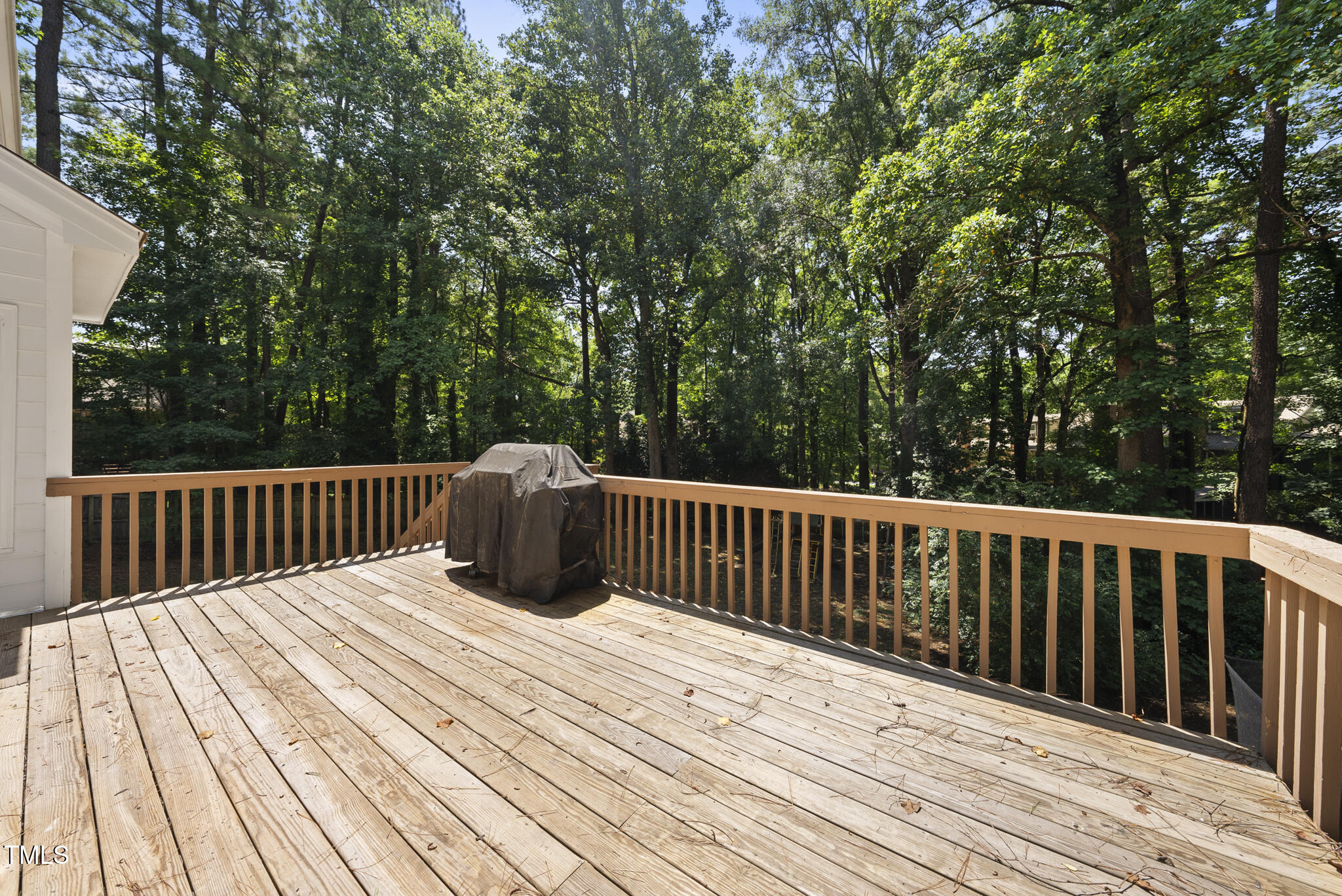 8716 Mourning Dove Road Raleigh, NC 27615 - Photo 32 of 44 a view of balcony with wooden floor and fence
