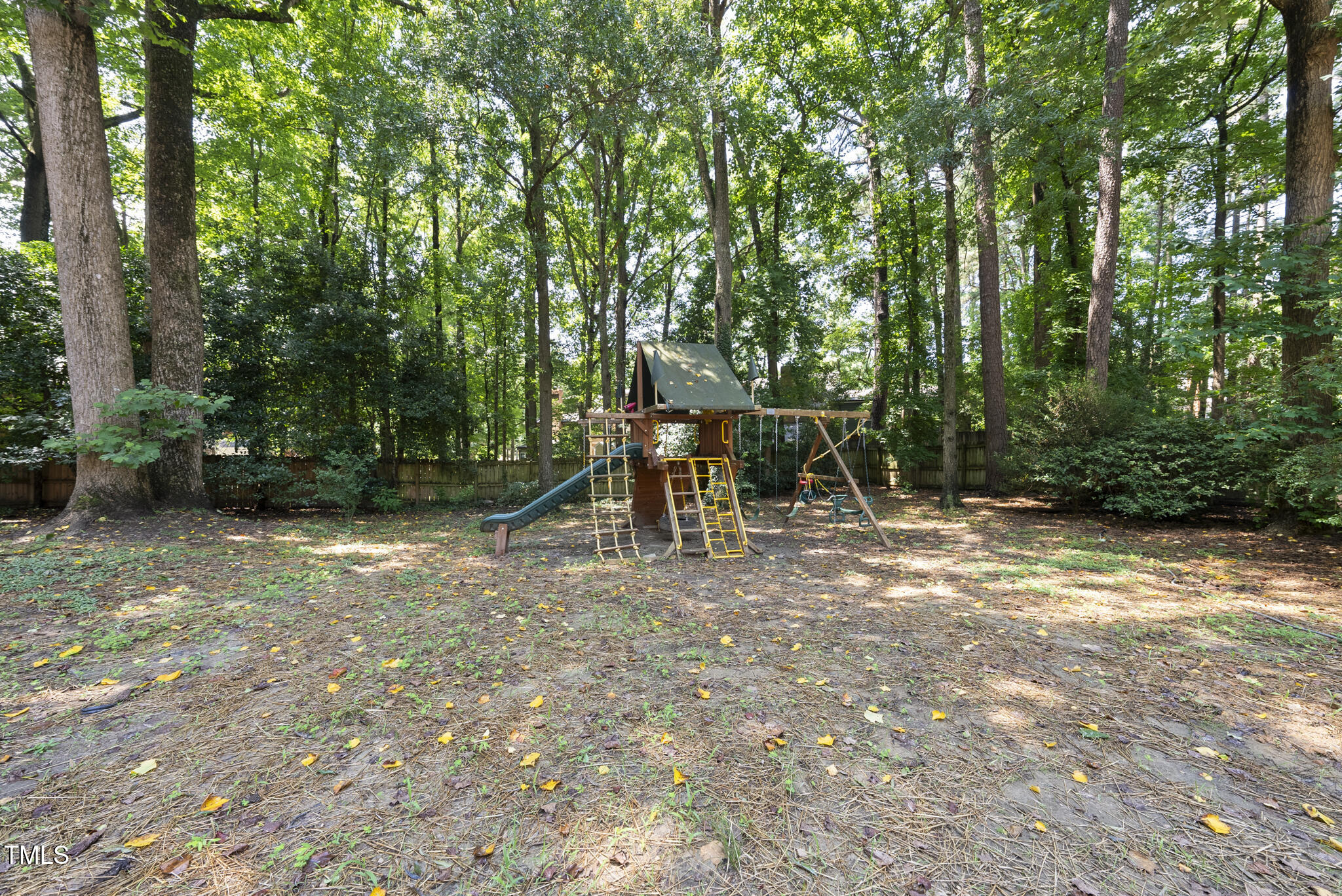 8716 Mourning Dove Road Raleigh, NC 27615 - Photo 34 of 44 a view of outdoor space with deck and trees