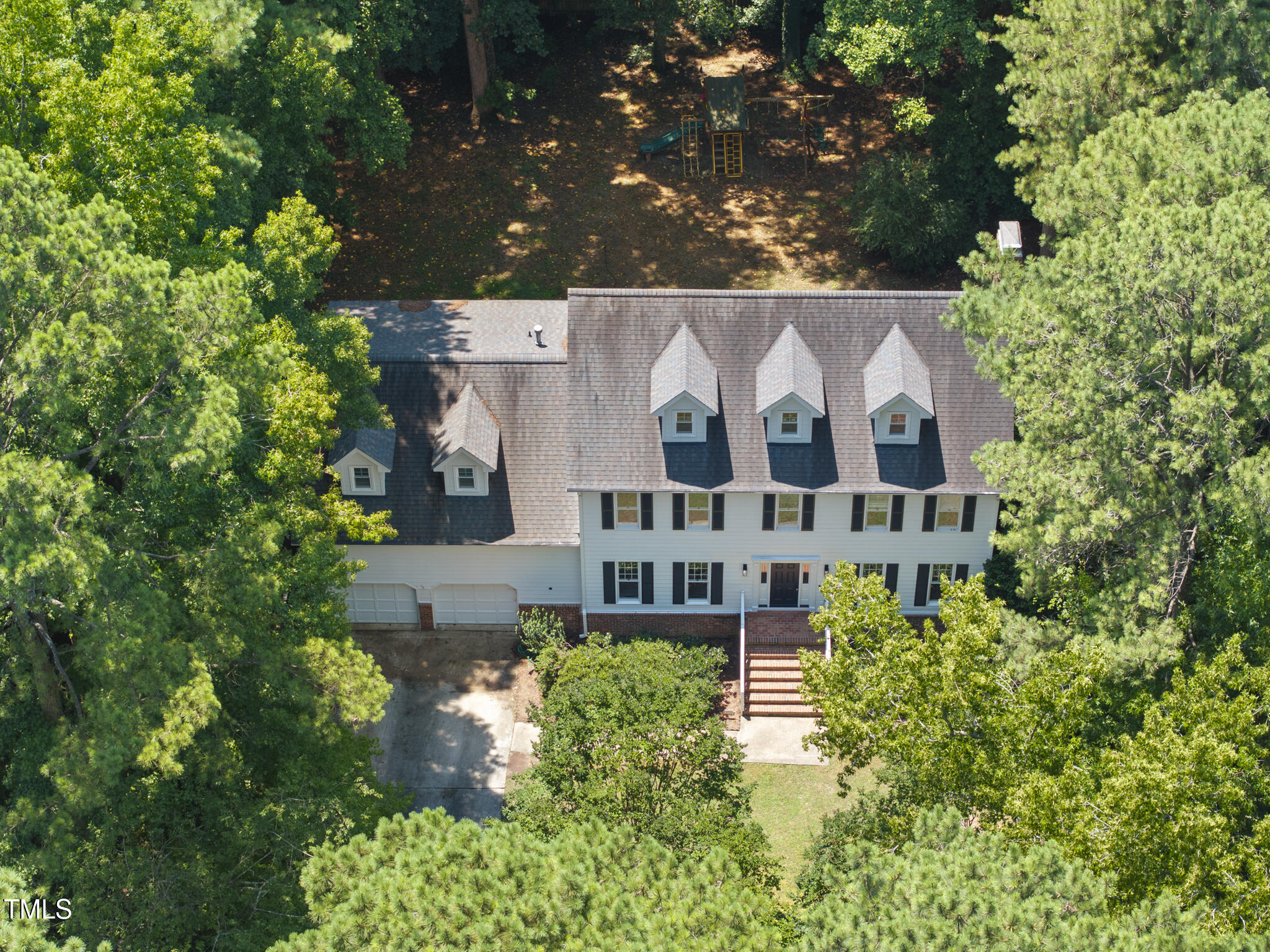 8716 Mourning Dove Road Raleigh, NC 27615 - Photo 39 of 44 front view of a house with a yard