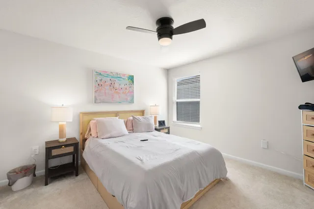a bathroom with a double vanity sink mirror and toilet