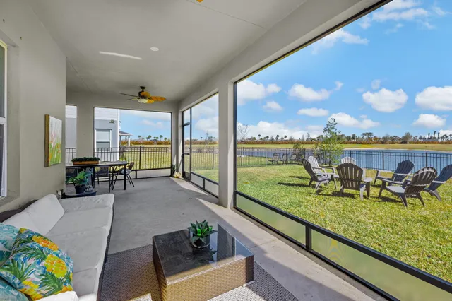 a view of swimming pool with outdoor seating