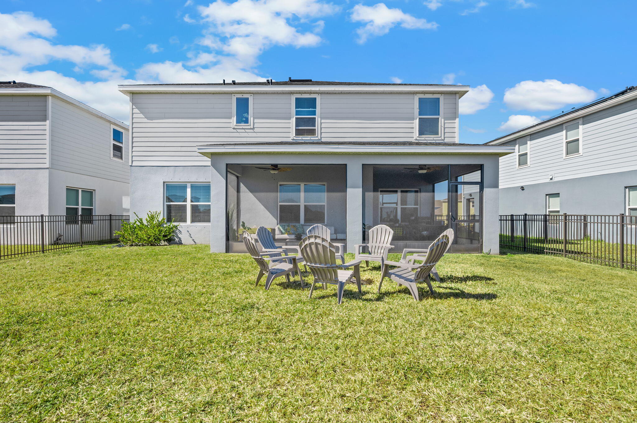 12297 Southwest Forli Way Port Port St. Lucie, FL 34987 - Photo 34 of 37 a view of a house with backyard porch and sitting area
