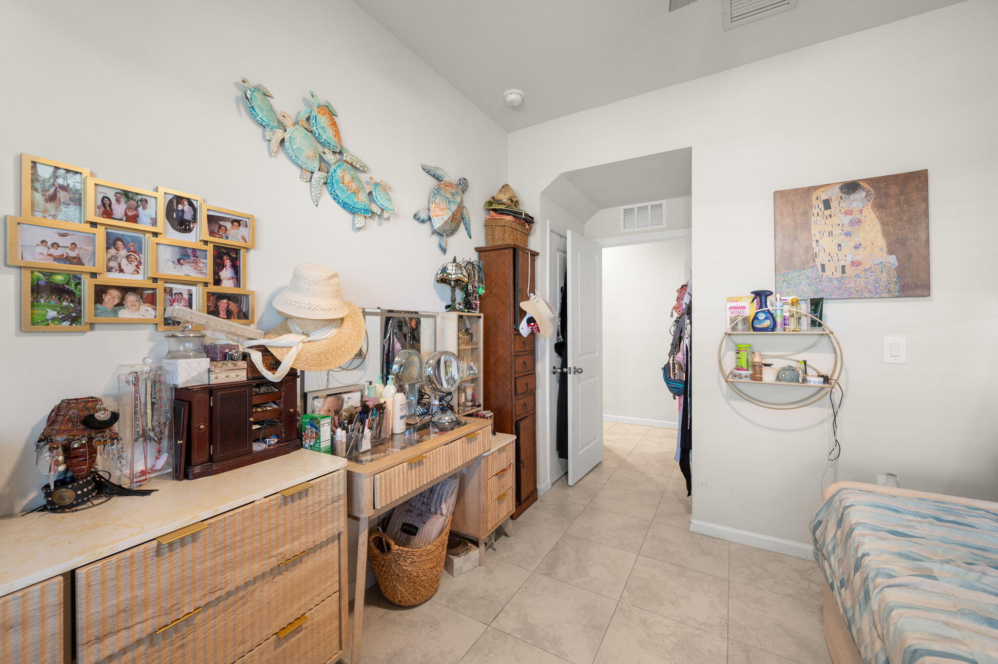 12297 Southwest Forli Way Port Port St. Lucie, FL 34987 - Photo 8 of 37 a bedroom with a bed and cabinets