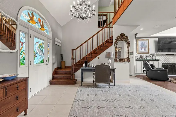 a view of a dining room with furniture and window