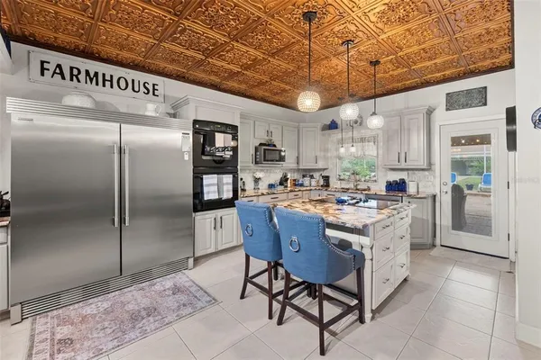 a view of entryway with workspace and a window