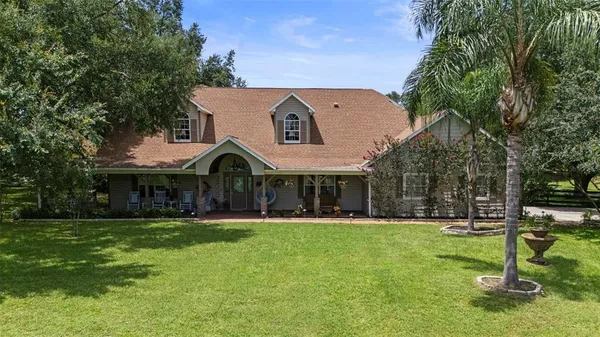 a backyard of a house with lots of green space