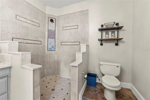 a bedroom with a bed and a television in it