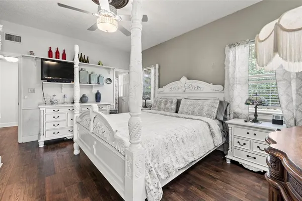 a view of a swimming pool with potted plants