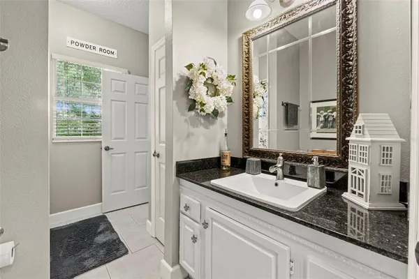 a view of a swimming pool with potted plants