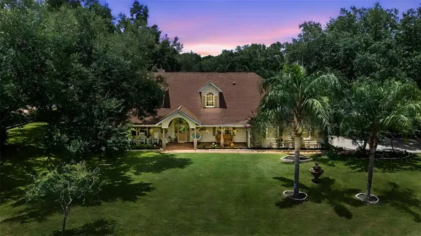 a living room with fireplace furniture and a flat screen tv