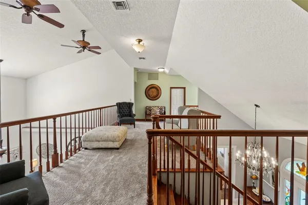 a front view of a house with a yard table and chairs
