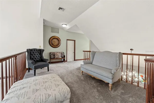 a view of a big yard with a house in the background