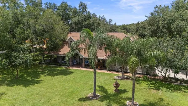 a living room with furniture fireplace and flat screen tv