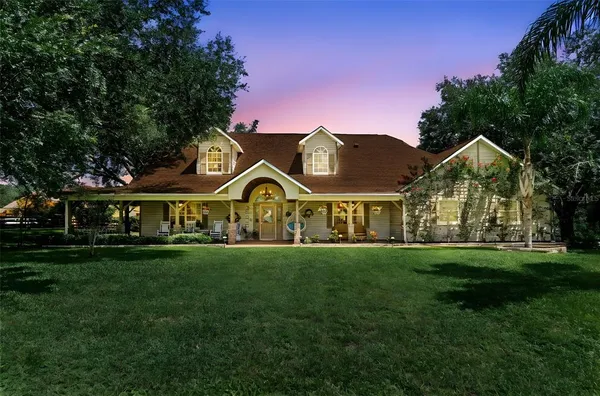 a kitchen with sink stove and cabinets