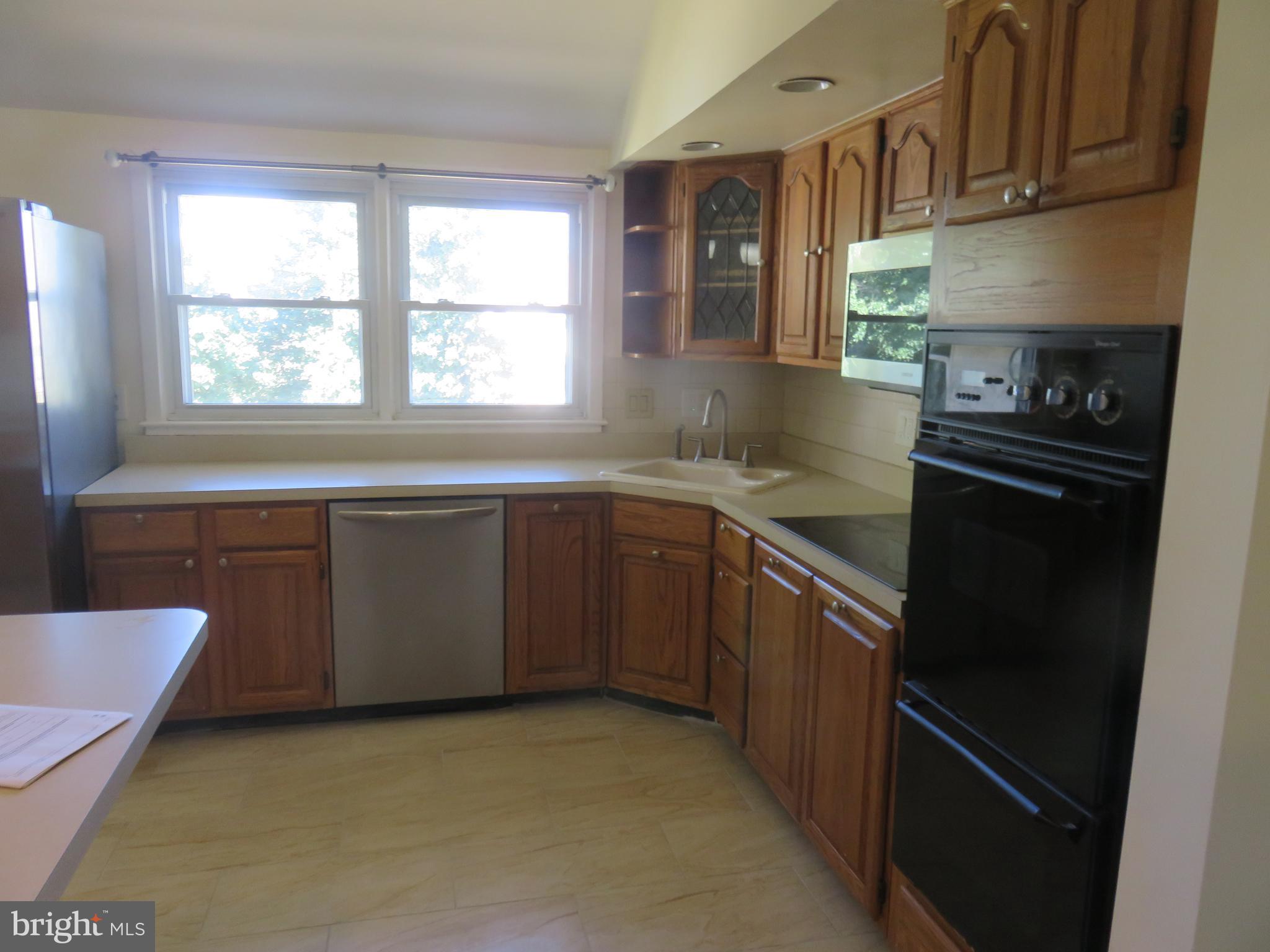 86 Kings Highway North Cherry Hill, NJ 08034 - Photo 12 of 22 a kitchen with a sink stove and cabinets