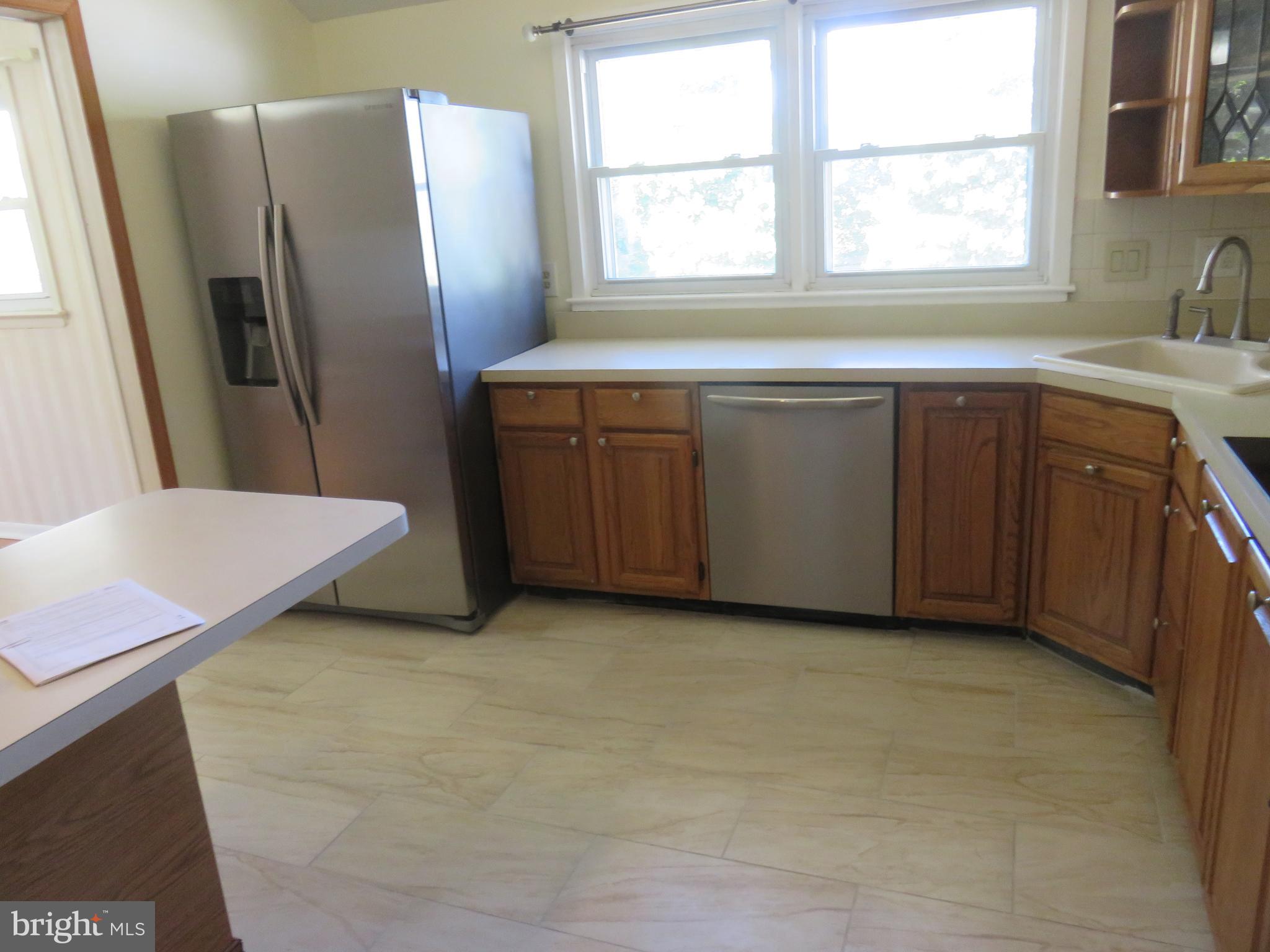 86 Kings Highway North Cherry Hill, NJ 08034 - Photo 13 of 22 a view of a kitchen with a sink dishwasher and a fireplace