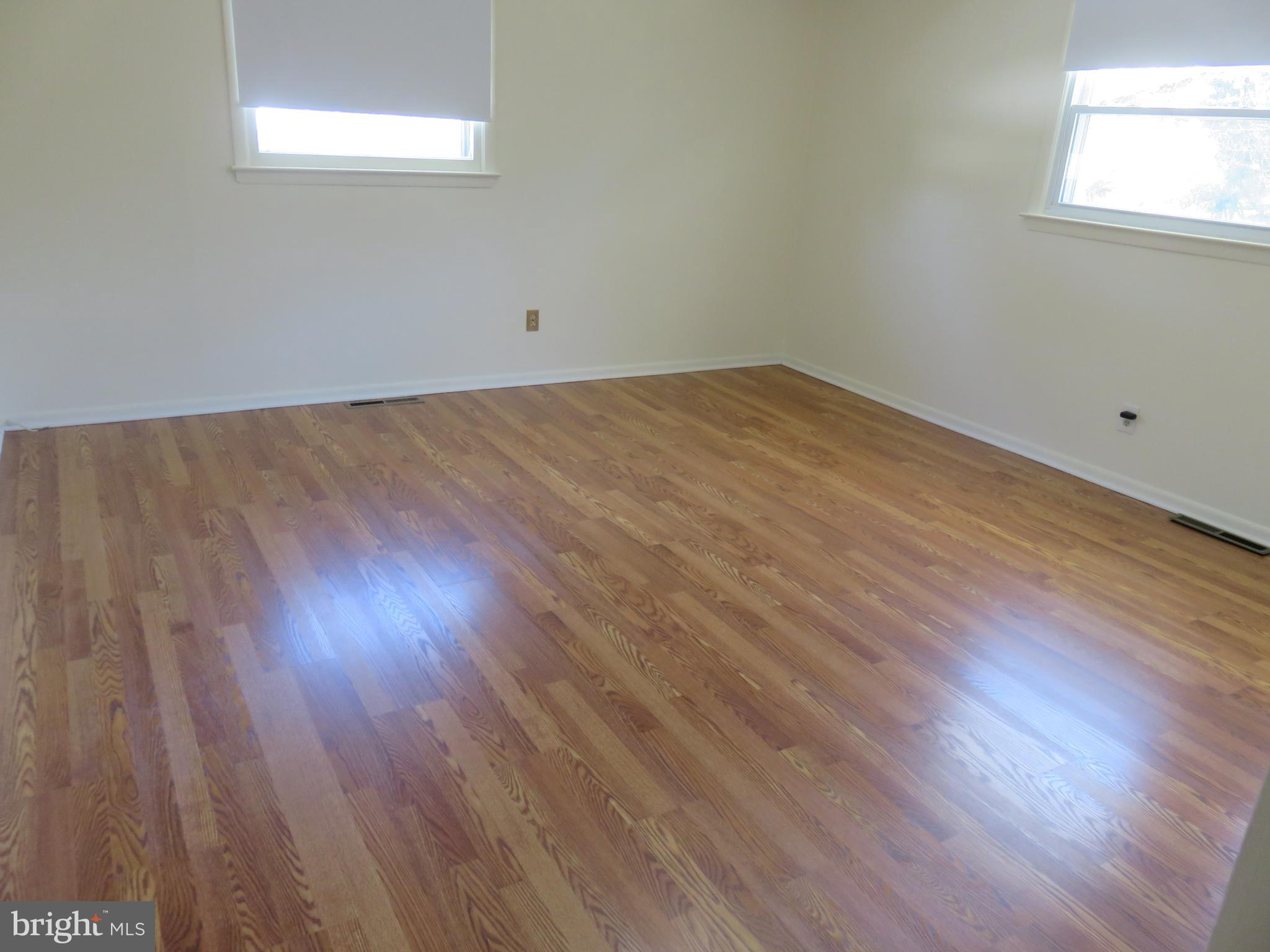 86 Kings Highway North Cherry Hill, NJ 08034 - Photo 7 of 22 a view of a room with wooden floor and windows