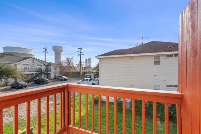 a view of a street from a balcony