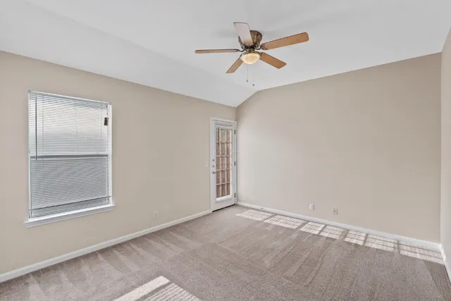 a view of a big room with wooden floor closet and fan