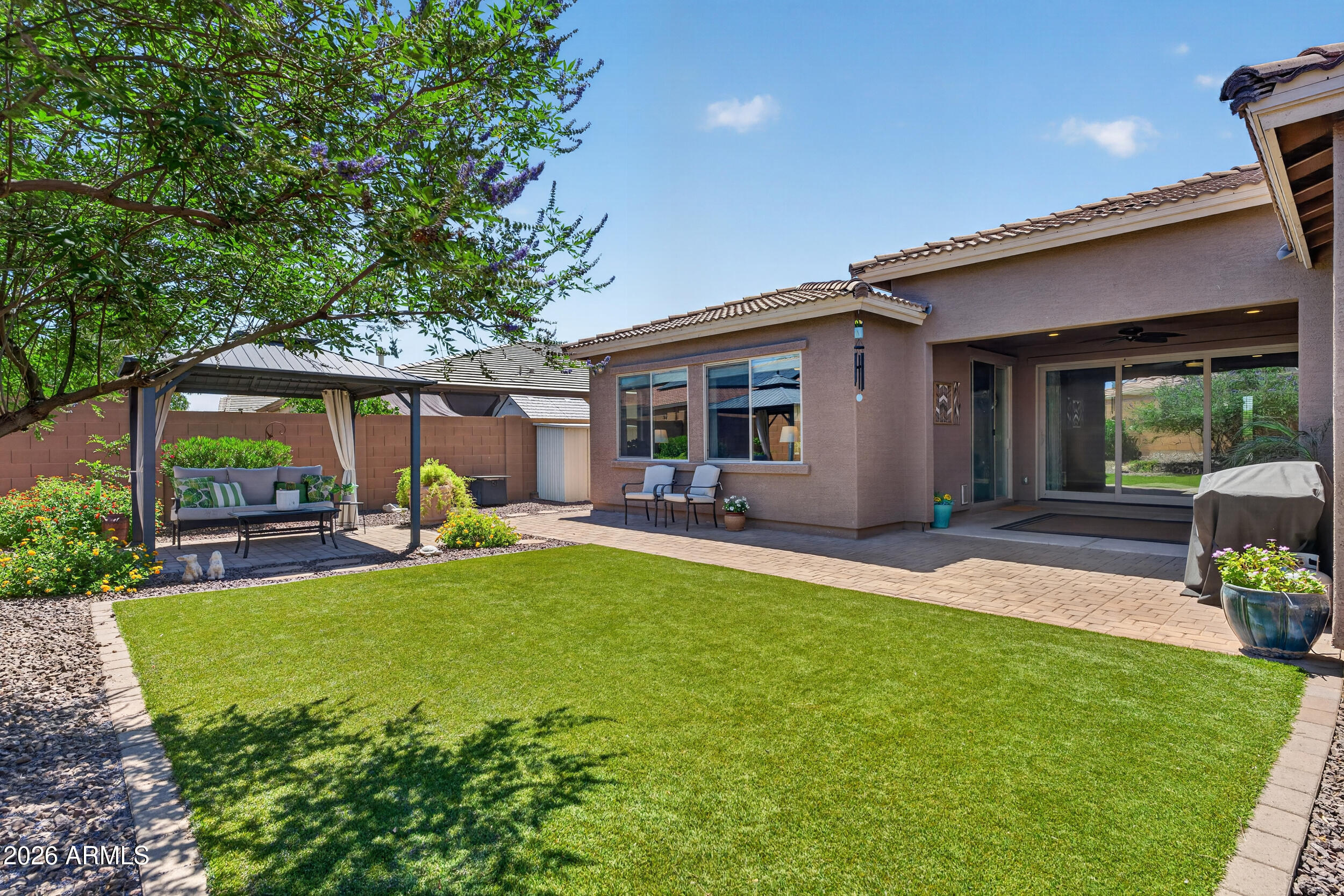 18612 West Mountain View Road Waddell, AZ 85355 - Photo 44 of 71 a view of a house with backyard and sitting area
