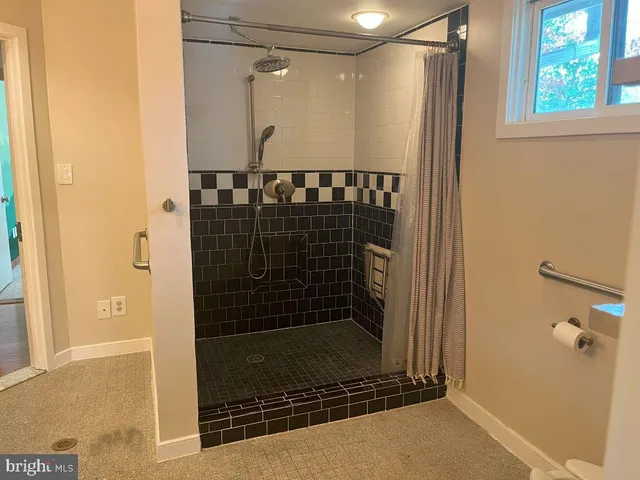 a bathroom with a toilet and a bathtub