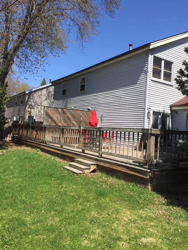 1116 North Alpine Road Rockford, IL 61107 - Photo 2 of 3 a view of backyard with deck and a garden