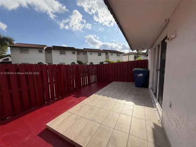 a view of a backyard of the house