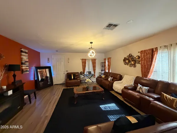 a living room with furniture fireplace and flat screen tv